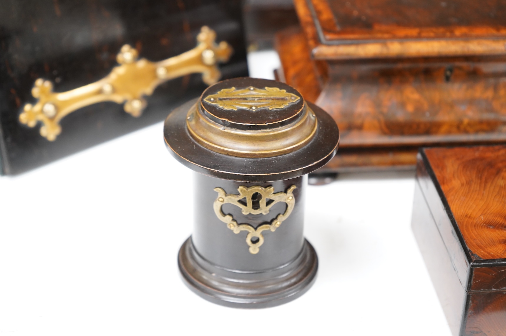 A collection of sundry items to include a Coromandel and brass mounted ink blotter pad, an early 19th century French yew veneered travelling writing box, an early 19th century mahogany desk stand and burr walnut bombé sh